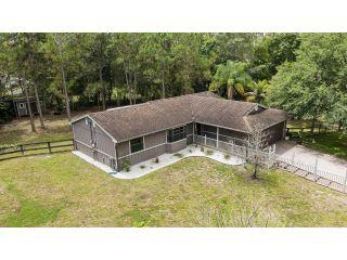 Property in The Acreage, FL 33470 thumbnail 1