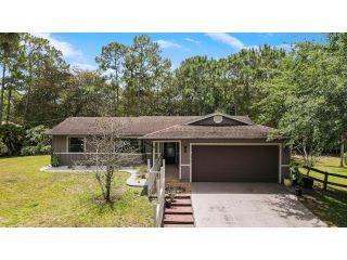 Property in The Acreage, FL 33470 thumbnail 0