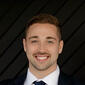 Headshot of Logan Everett of Pure Michigan Realty Group