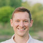 Headshot of Logan Burns of Pure Michigan Realty Group