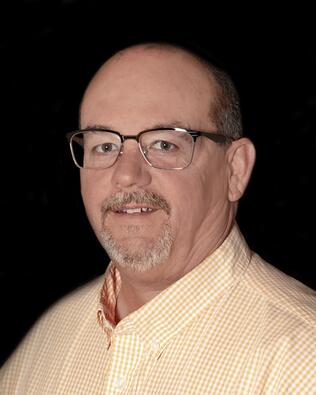 Headshot of Greg McCluskey