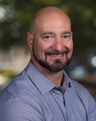 Headshot of Adam Kohn