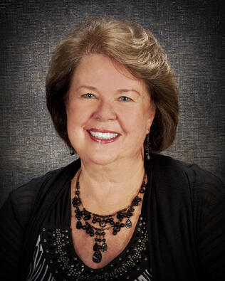 Headshot of Janet Brennan