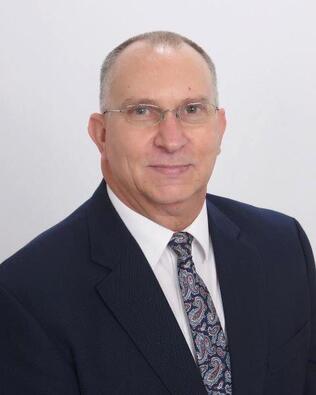 Headshot of Delbert Cogar