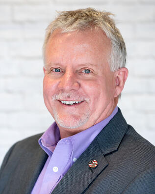 Headshot of Chuck Jonaitis