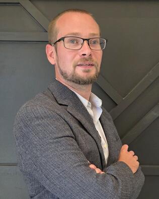 Headshot of Anthony Clore