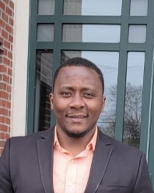 Headshot of Ade Adekunle