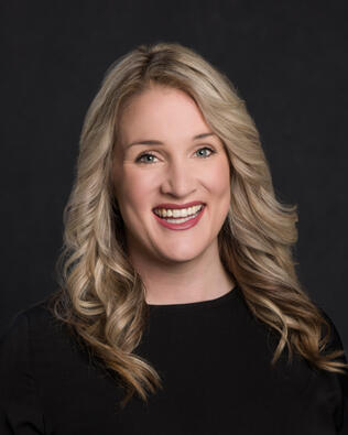 Headshot of Amber Deschamp REALTOR®