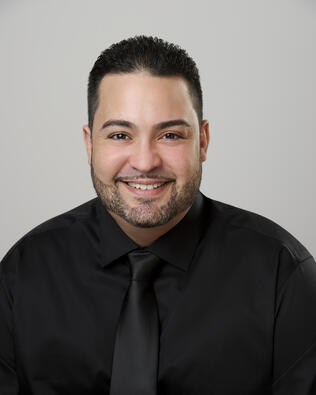 Headshot of Luis Negron Jr