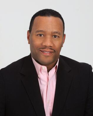 Headshot of Reggie Sumter