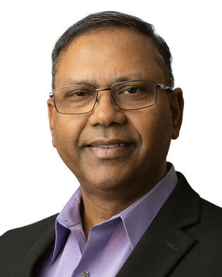 Headshot of John Kurien