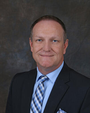 Headshot of Michael Greer
