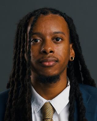 Headshot of Cedric Coston