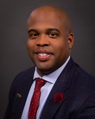 Headshot of Nicholas Halmond- Walters