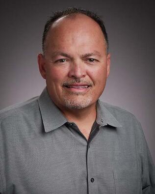 Headshot of Gilbert Olgin