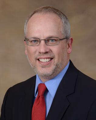 Headshot of Stephen Wiggins