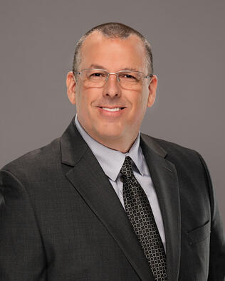 Headshot of WILLIAM REYNOLDS