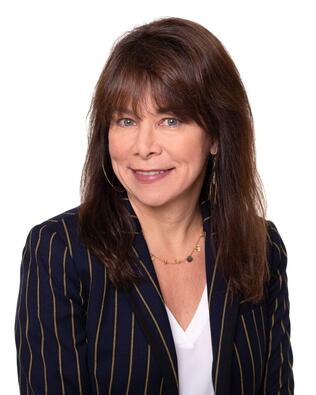 Headshot of Roseanne May