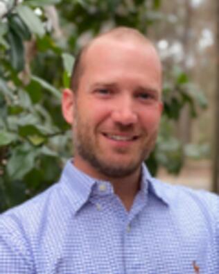 Headshot of Travis Atkinson