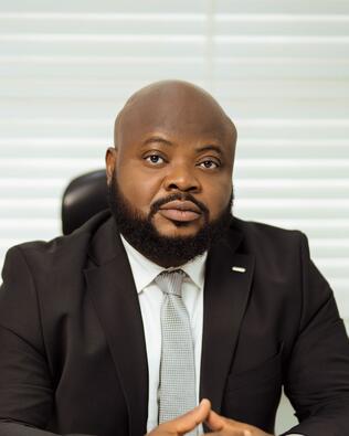 Headshot of Tola Ayanlola