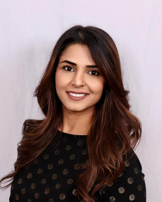 Headshot of Maleeka Hemani