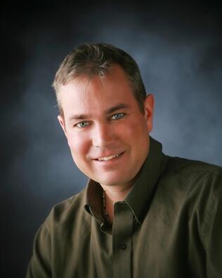 Headshot of Travis Hein