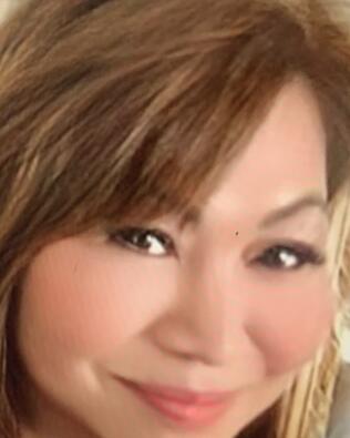 Headshot of Zenaida Dela Cruz
