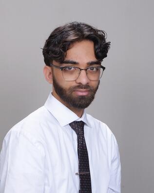 Headshot of Zain Faiz