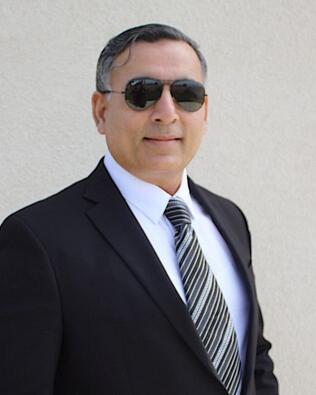 Headshot of Qamar Cheema