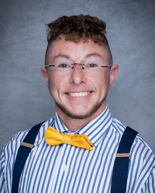 Headshot of Ash Elkins