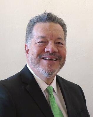 Headshot of Claude Delgado