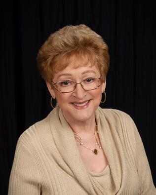 Headshot of Joan Daste
