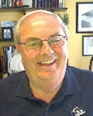 Headshot of Ray M Becker
