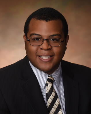 Headshot of Chris Cadet