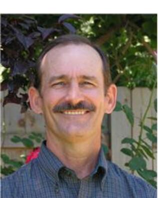 Headshot of Dennis Louber
