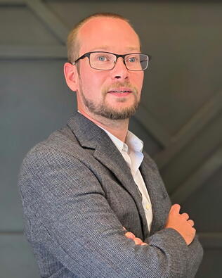 Headshot of Anthony Clore