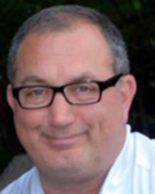 Headshot of Kourosh Nosrati