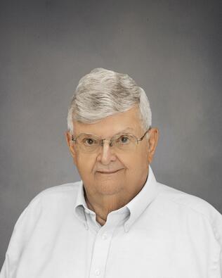 Headshot of Larry E Whitney