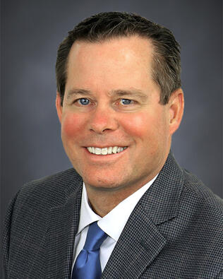 Headshot of George Ricker