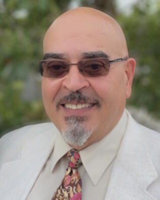 Headshot of Ali Alshalkmi