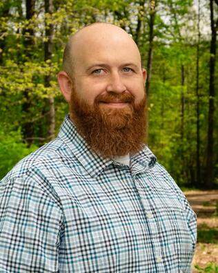 Headshot of CALEB GILLEAN