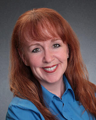 Headshot of Sheila Muniz