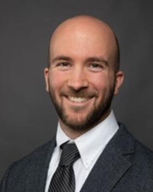 Headshot of Alex Pisconski