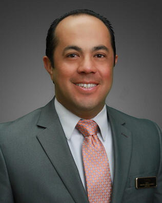 Headshot of J. Trinidad Hernandez