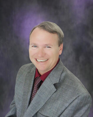 Headshot of Dennis White