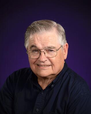 Headshot of Adrian Cox