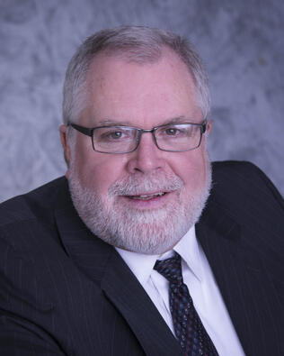 Headshot of David C Reault