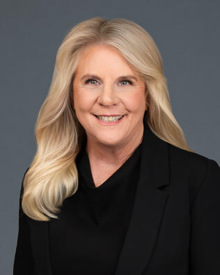 Headshot of Dana 'DeLong' Wenzell