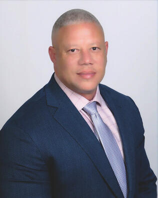Headshot of David Delasbour