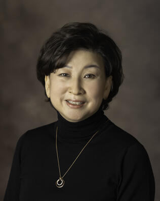 Headshot of Jisue Sue